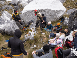 https://www.peru-reservations.com/wp-content/uploads/2025/11/grupo_de_personas_descansando_entre_rocas_grandes_y_pasto-group_of_people_resting_among_large_rocks_and_grass-320x240.png